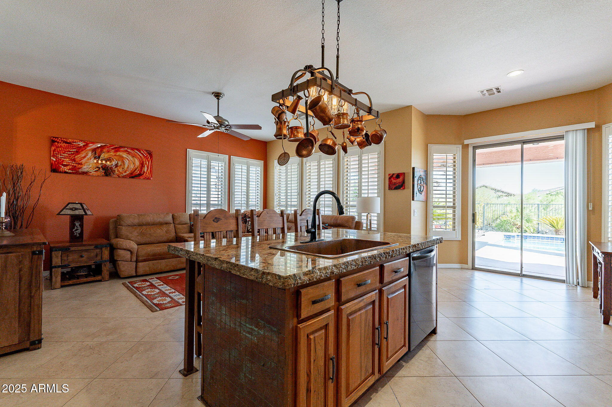 4333 South Pony Rider Trail Gold Canyon, AZ 85118 - Photo 18 of 54 a kitchen with stainless steel appliances granite countertop a sink a stove and a wooden floors