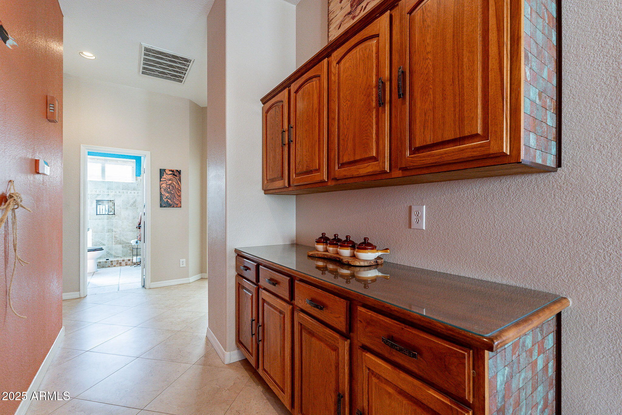 4333 South Pony Rider Trail Gold Canyon, AZ 85118 - Photo 27 of 54 a kitchen with stainless steel appliances wooden cabinets and a sink