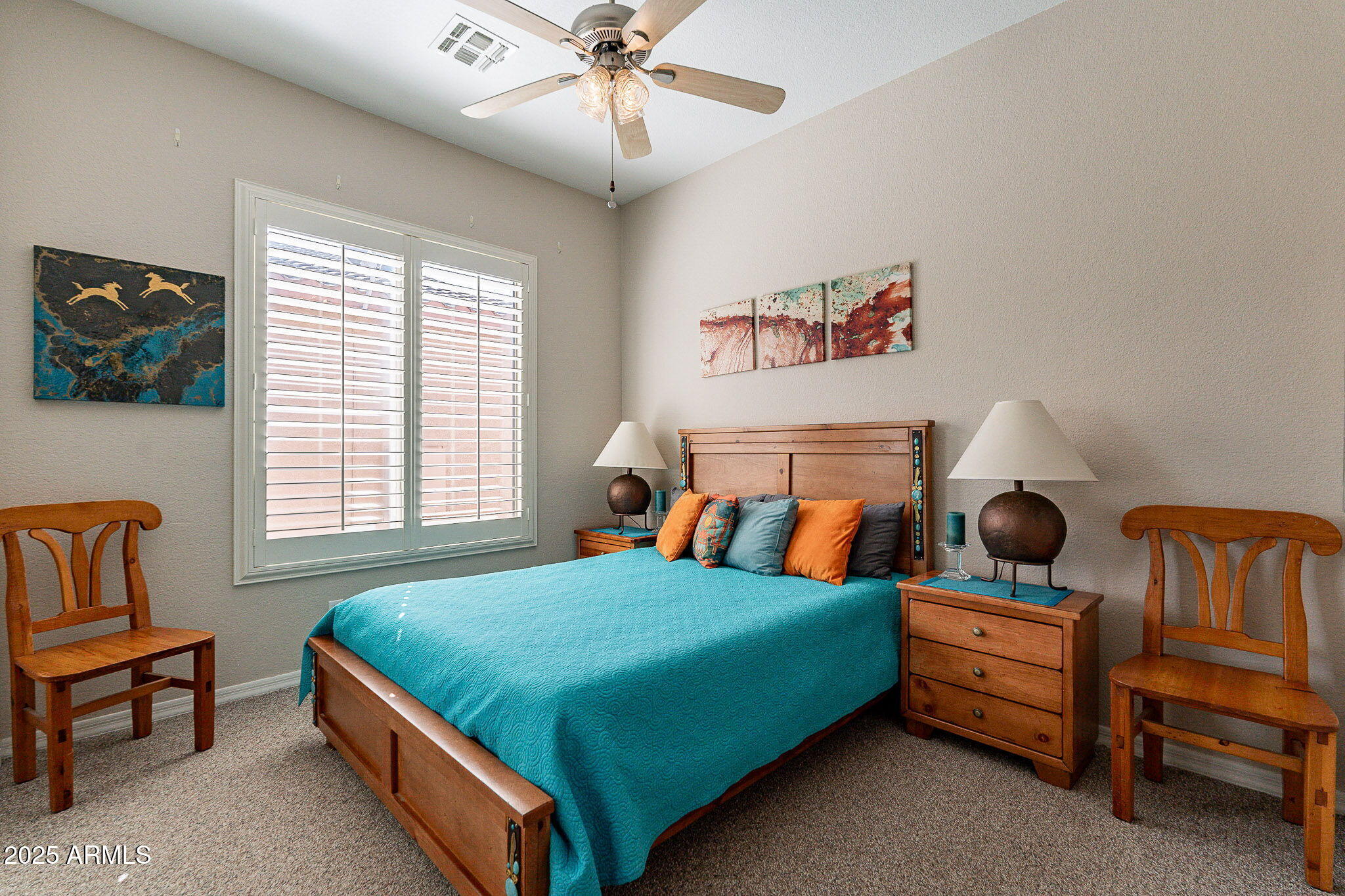 4333 South Pony Rider Trail Gold Canyon, AZ 85118 - Photo 37 of 54 a bedroom with a bed and a chandelier