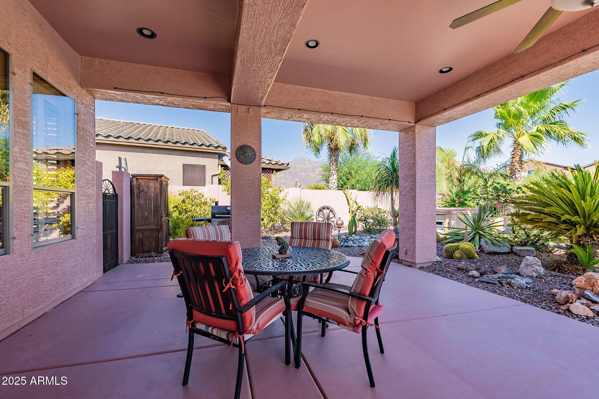 4333 South Pony Rider Trail Gold Canyon, AZ 85118 - Photo 41 of 54 a view of an outdoor dining space with a table and chairs in patio
