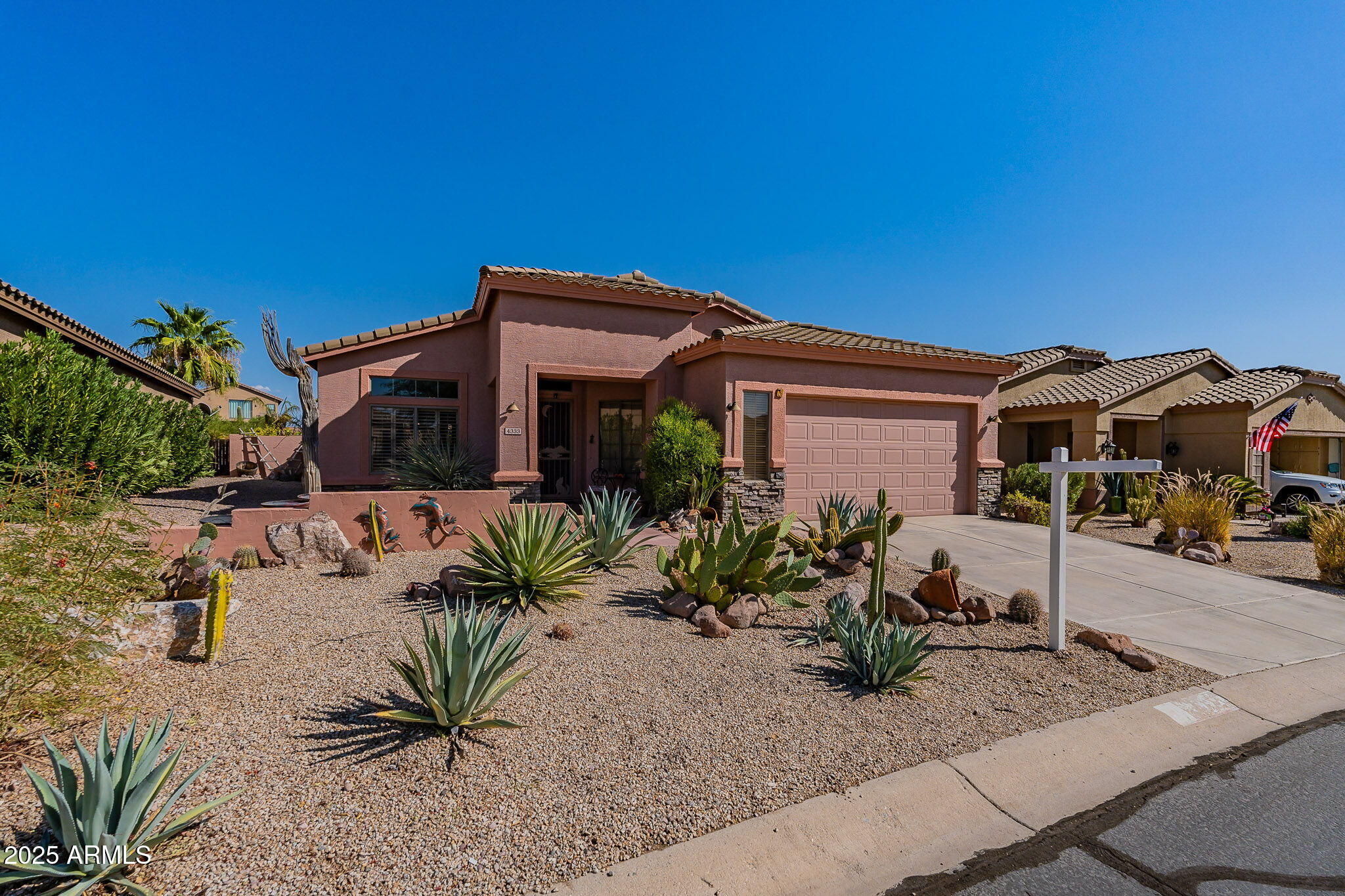 4333 South Pony Rider Trail Gold Canyon, AZ 85118 - Photo 6 of 54 a front view of a house with garden
