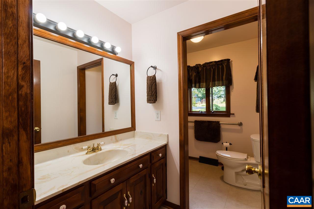 1655 Swift Run Road Ruckersville, VA 22968 - Photo 11 of 32 a en suite bathroom with a granite countertop sink toilet and mirror