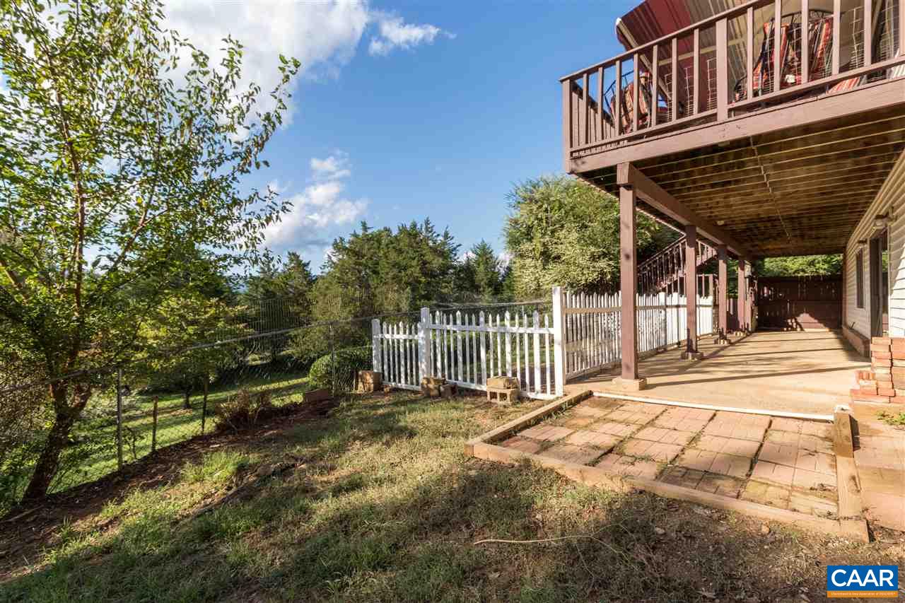 1655 Swift Run Road Ruckersville, VA 22968 - Photo 21 of 32 a view of a house with a wooden deck
