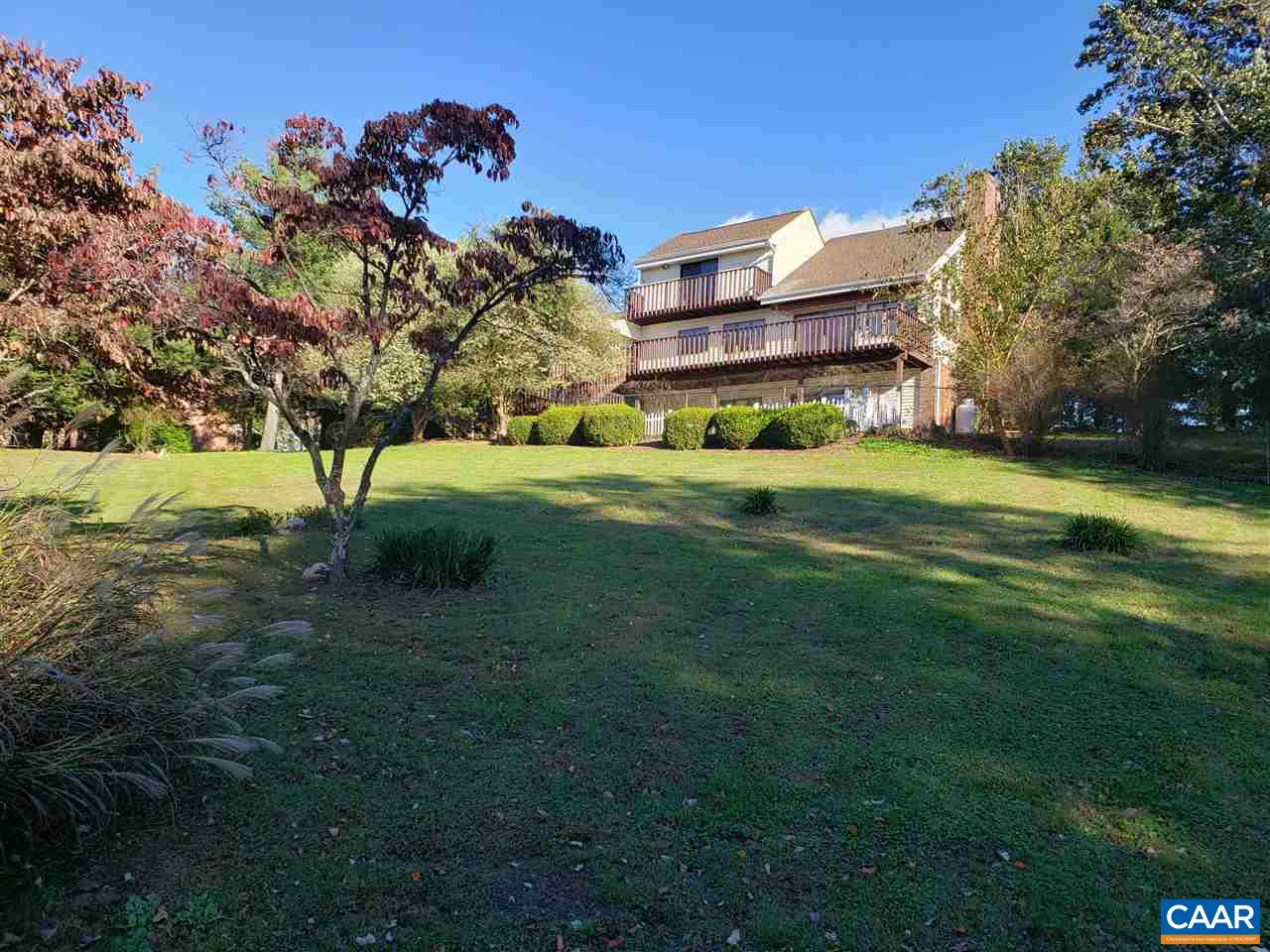 1655 Swift Run Road Ruckersville, VA 22968 - Photo 28 of 32 a view of a big yard with plants and a large tree
