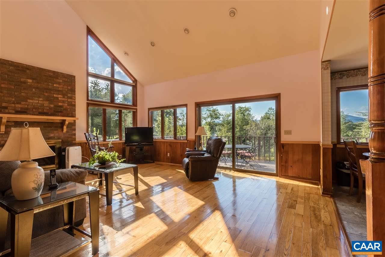1655 Swift Run Road Ruckersville, VA 22968 - Photo 6 of 32 a living room with furniture and a floor to ceiling window