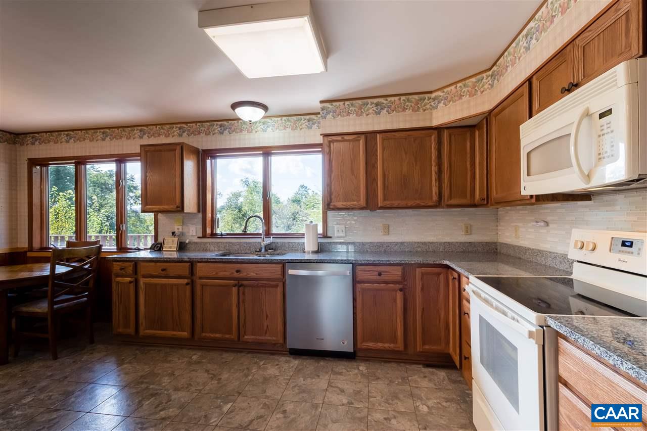 1655 Swift Run Road Ruckersville, VA 22968 - Photo 8 of 32 a kitchen with lots of counter top space and wooden floor