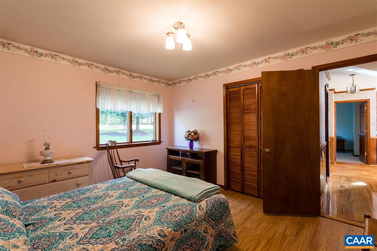 1655 Swift Run Road Ruckersville, VA 22968 - Photo 10 of 32 a bedroom with a bed and a dresser