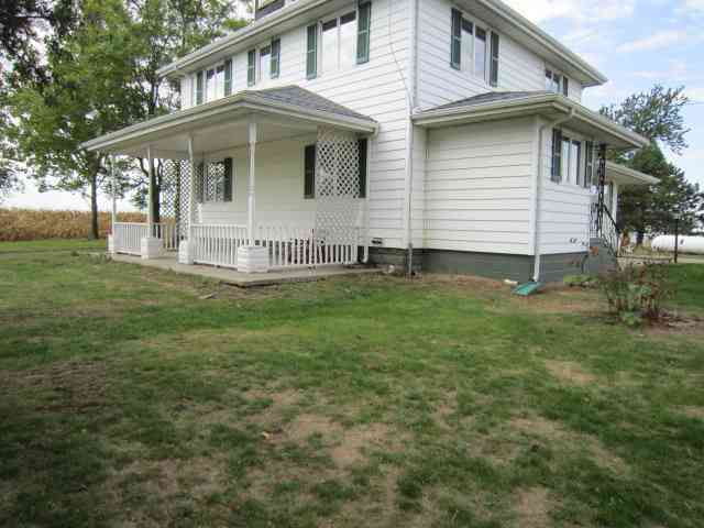 a view of house with yard