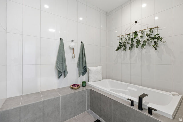 2197 Reserve Circle St. George, UT 84770 - Photo 31 of 57 Bathroom featuring tile walls and a garden tub