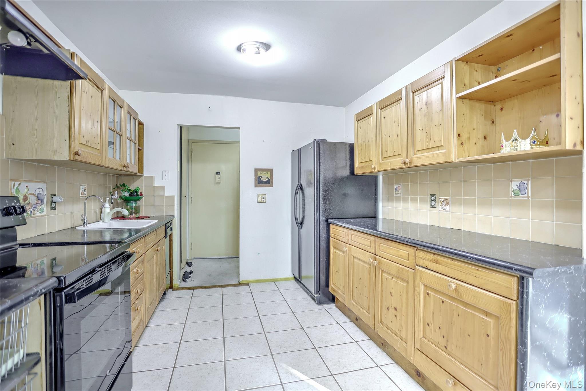 5 Secora Road, Unit F7 Spring Valley, NY 10977 - Photo 11 of 26 a kitchen with stainless steel appliances granite countertop a sink and cabinets