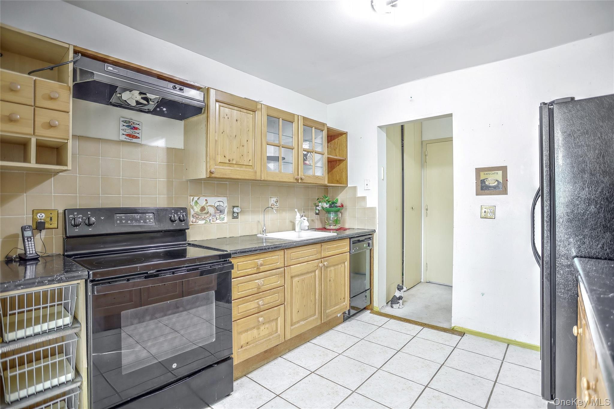 5 Secora Road, Unit F7 Spring Valley, NY 10977 - Photo 12 of 26 a kitchen with stainless steel appliances a stove and a refrigerator