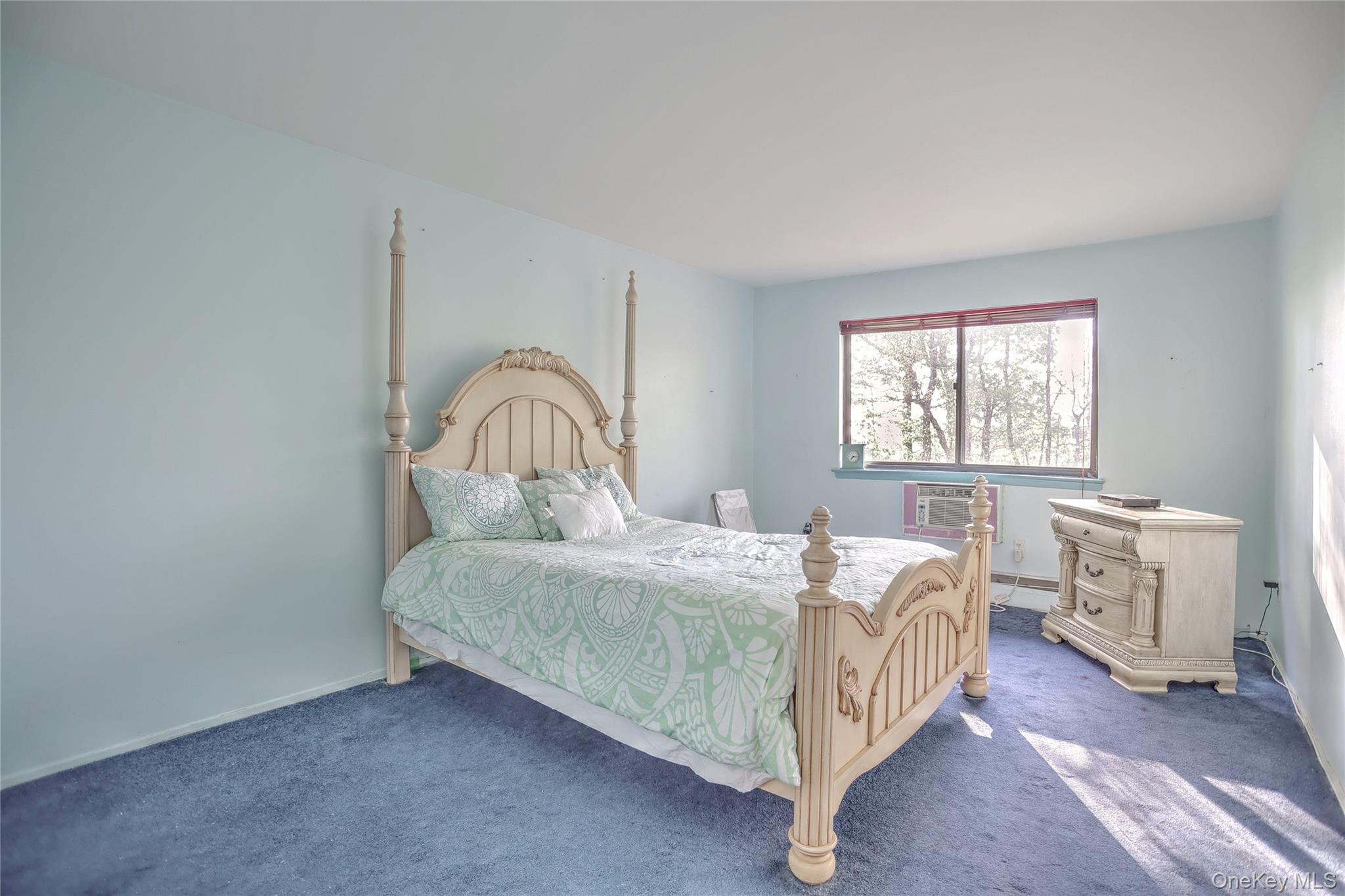 5 Secora Road, Unit F7 Spring Valley, NY 10977 - Photo 14 of 26 a bedroom with a bed and a window