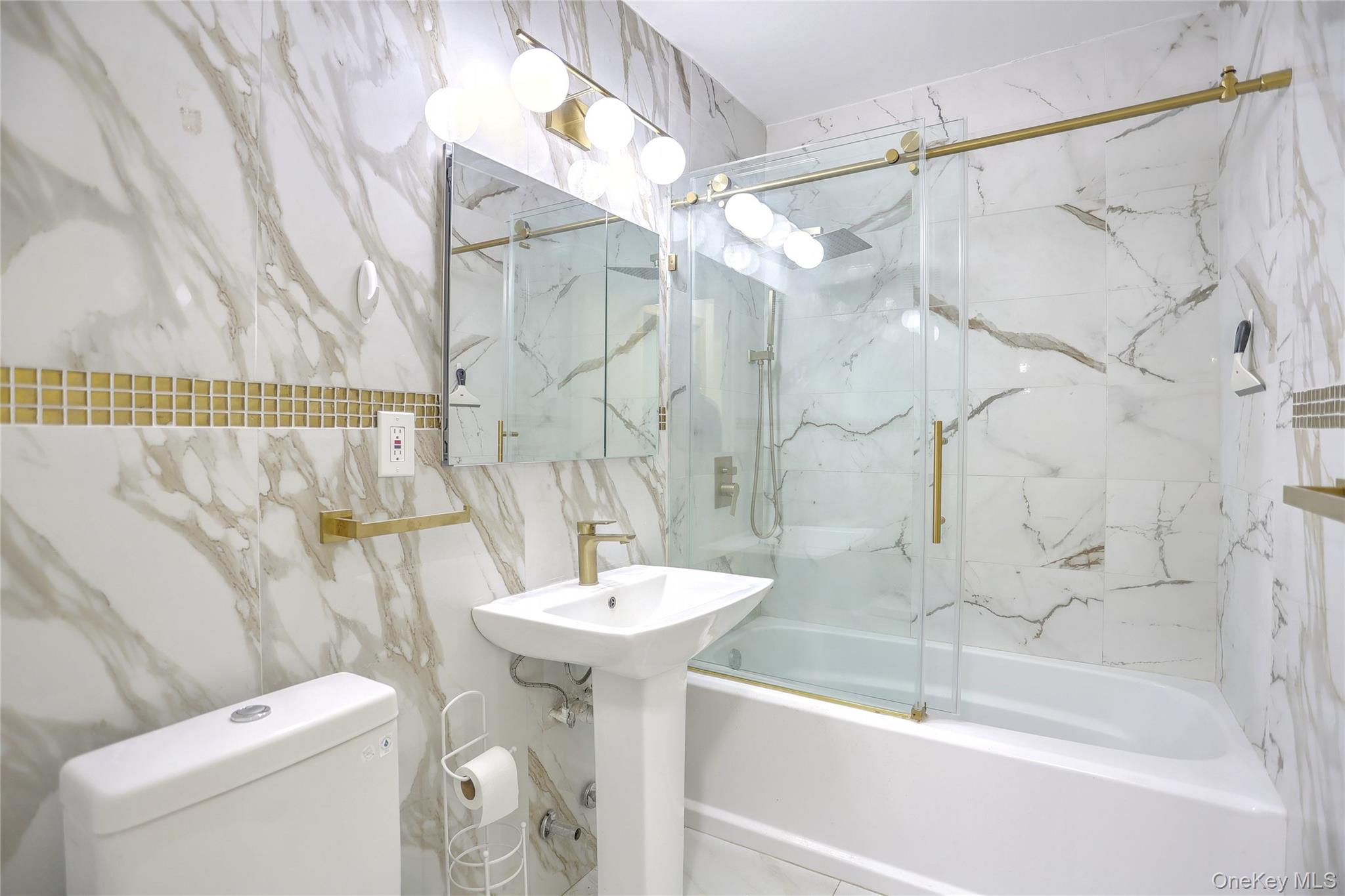 5 Secora Road, Unit F7 Spring Valley, NY 10977 - Photo 16 of 26 a bathroom with a sink a toilet and shower