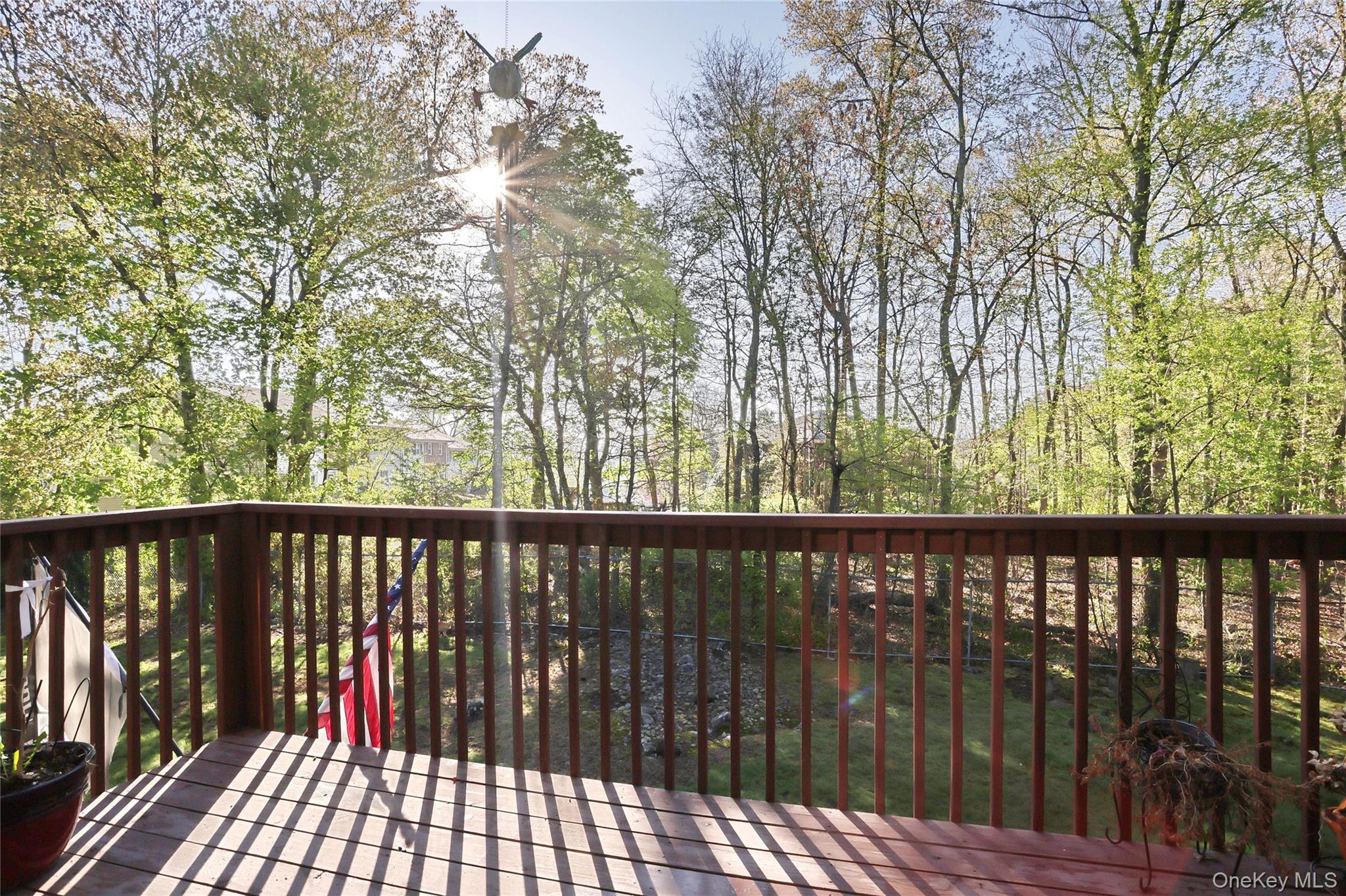 5 Secora Road, Unit F7 Spring Valley, NY 10977 - Photo 17 of 26 a balcony with wooden floor and outdoor space