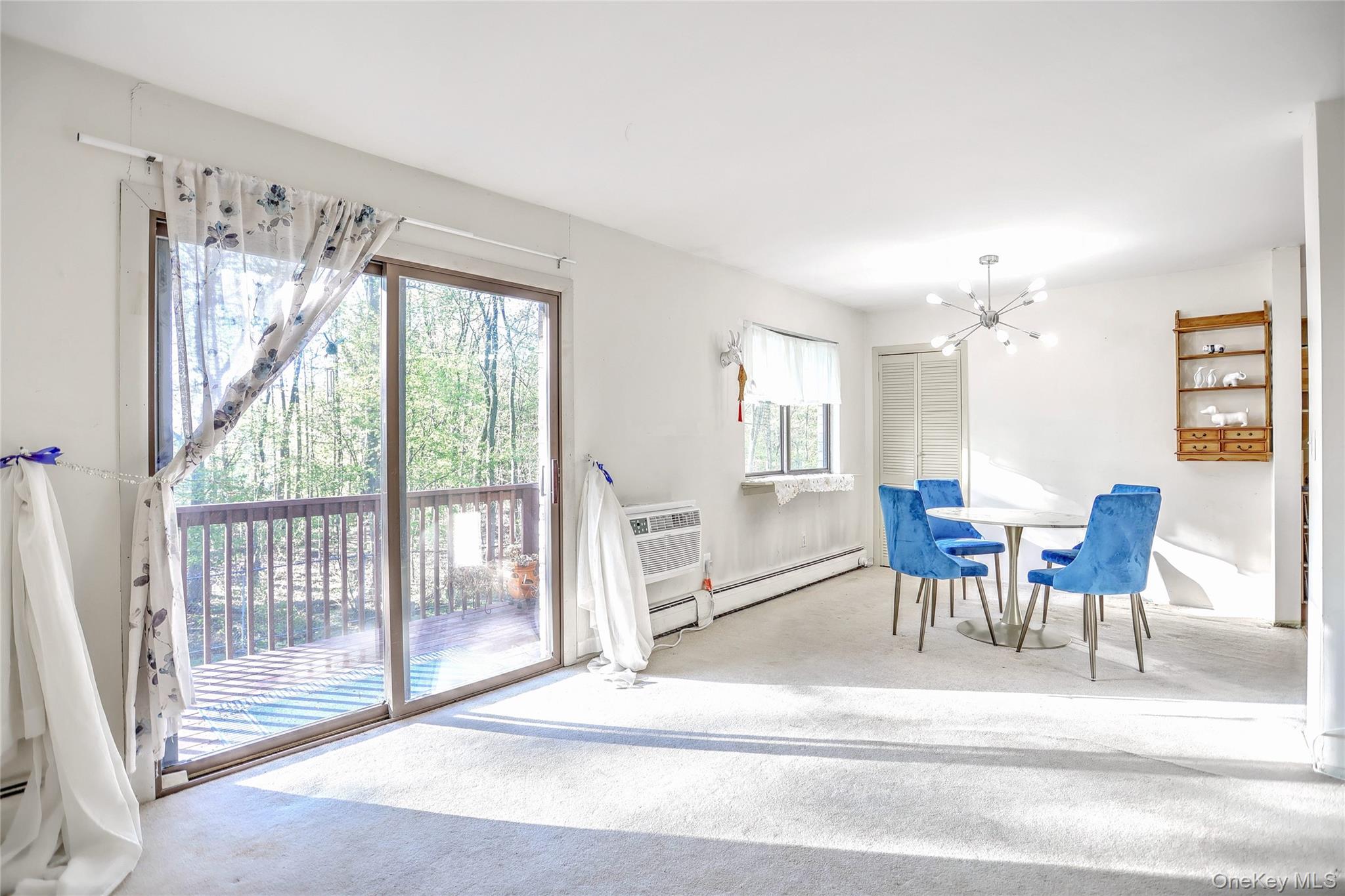 5 Secora Road, Unit F7 Spring Valley, NY 10977 - Photo 8 of 26 a living room with furniture and a large window