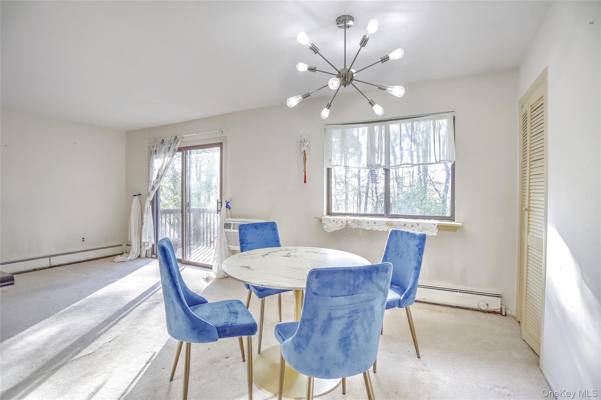 5 Secora Road, Unit F7 Spring Valley, NY 10977 - Photo 9 of 26 a view of a dining room with furniture and window