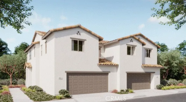 a view of a house with a yard and garage
