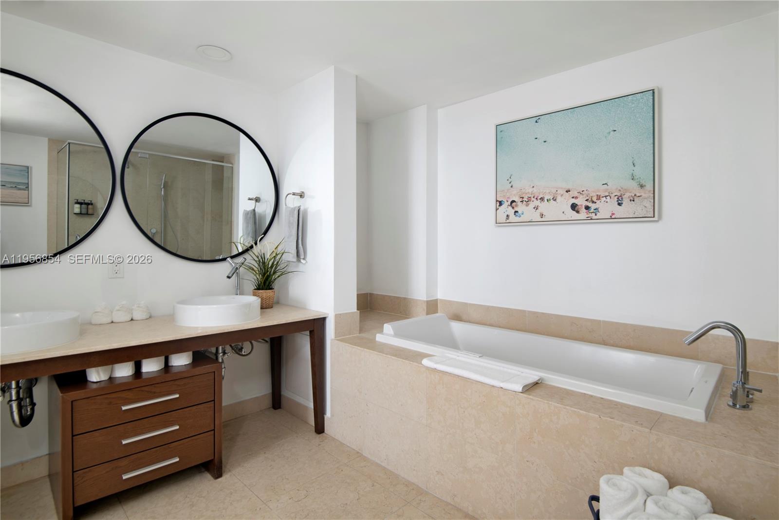 485 Brickell Avenue, Unit 3208 Miami, FL 33131 - Photo 21 of 29 a bathroom with a sink and a mirror