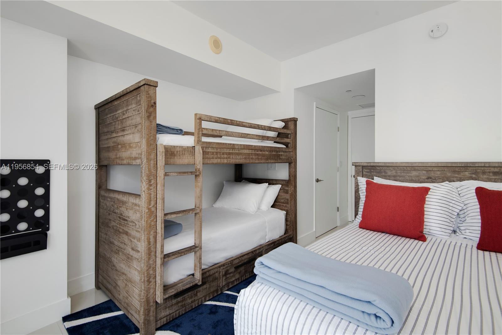 485 Brickell Avenue, Unit 3208 Miami, FL 33131 - Photo 26 of 29 a bedroom with a bed and a window