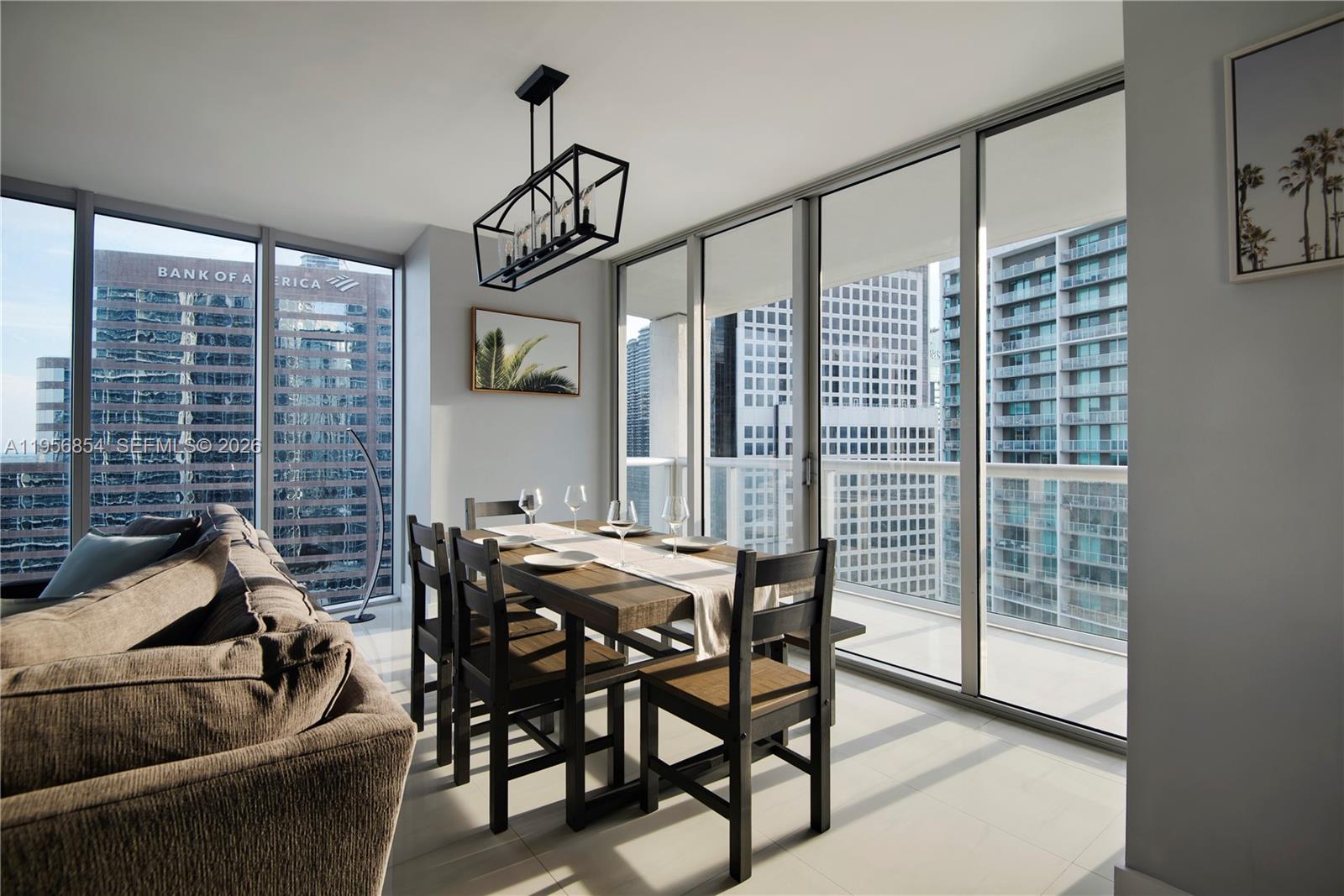 485 Brickell Avenue, Unit 3208 Miami, FL 33131 - Photo 5 of 29 a view of a dining room with furniture window and outside view
