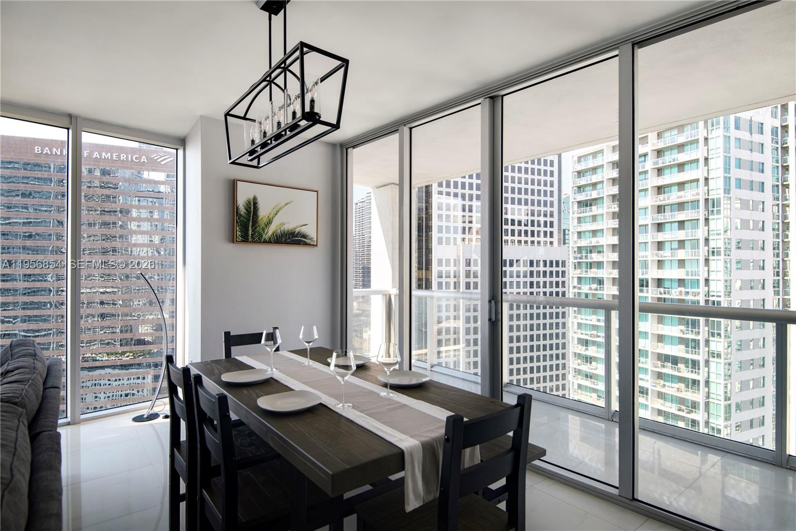 485 Brickell Avenue, Unit 3208 Miami, FL 33131 - Photo 9 of 29 a view of a dining room with furniture window and outside view