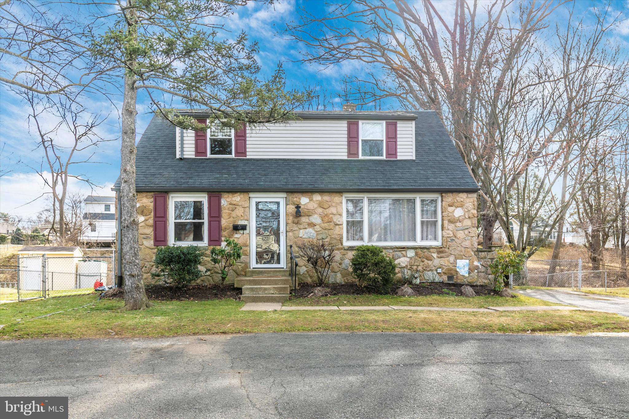 1502 Church Road Oreland, PA 19075 - Photo 1 of 39 a front view of a house with garden