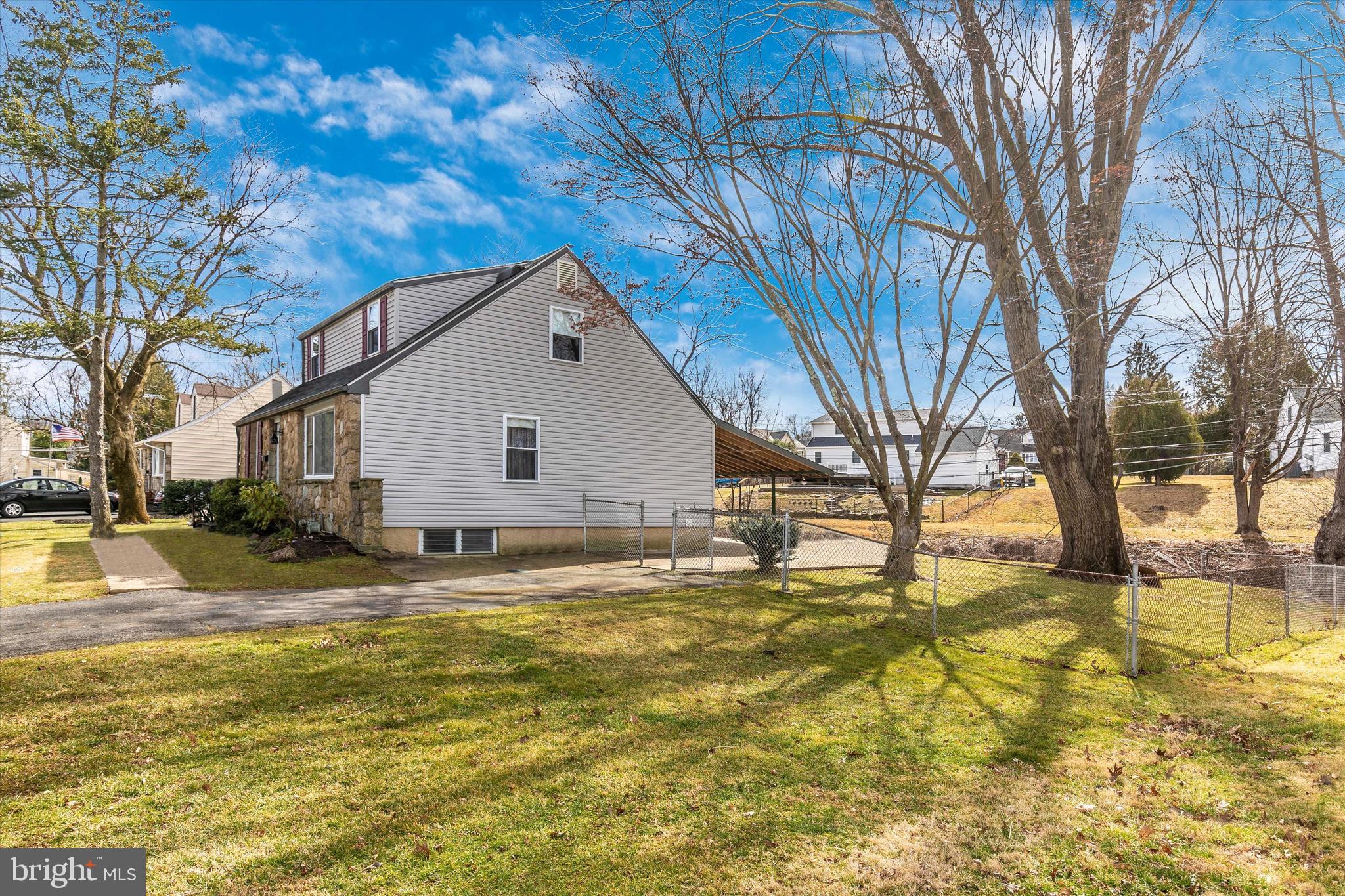 1502 Church Road Oreland, PA 19075 - Photo 36 of 39 a view of a yard with a large tree