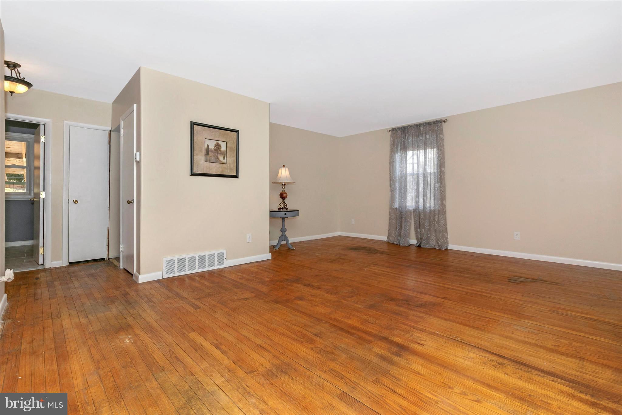1502 Church Road Oreland, PA 19075 - Photo 8 of 39 a view of an empty room and wooden floor