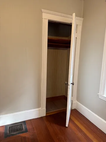 a view of front door with wooden floor