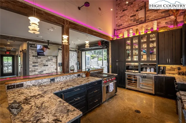a kitchen with stove and cabinets