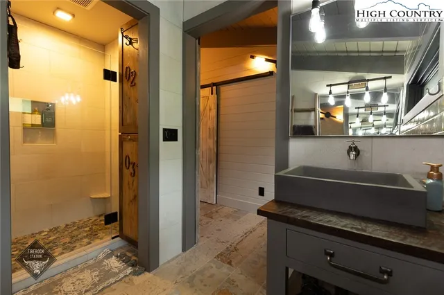 a view of a roof deck with wooden floor and barbeque oven