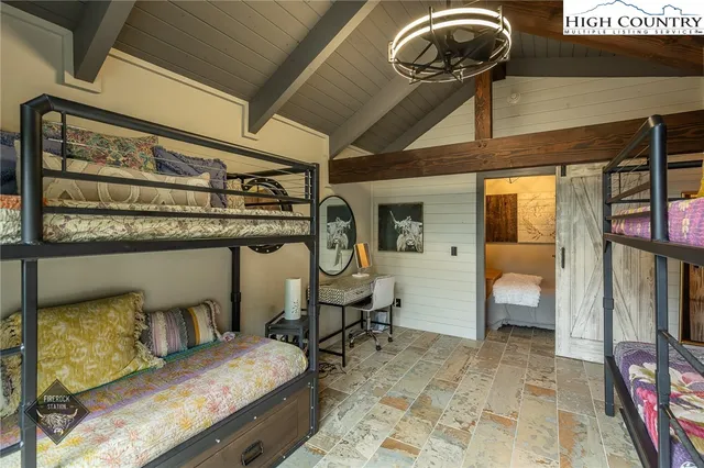 a view of a livingroom with furniture and a flat screen tv