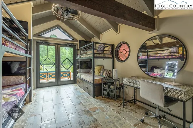 a bathroom with a sink window and a mirror