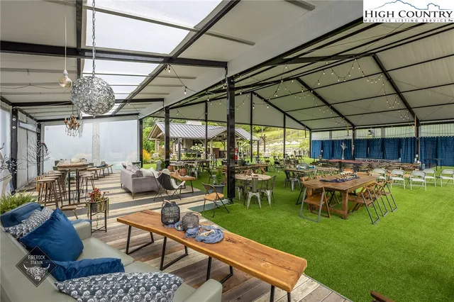 a view of an outdoor sitting area with swimming pool