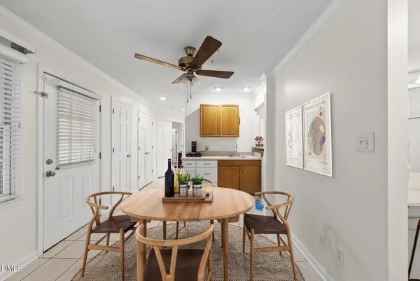 a kitchen with white cabinets and appliances