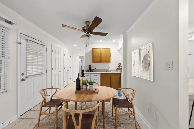 a kitchen with white cabinets and appliances