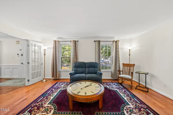 a living room with furniture fireplace and flat screen tv
