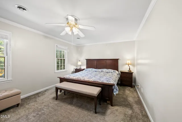 a view of a house with yard and tree s