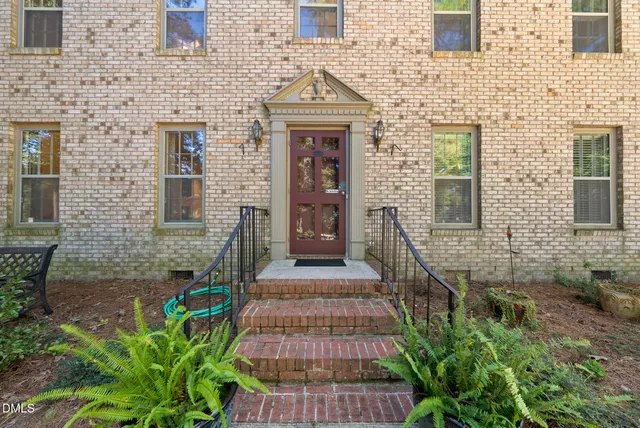 a black and white photo of a bench