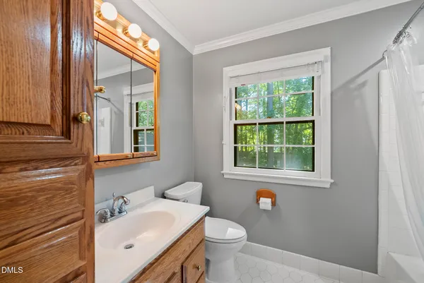 a view of a livingroom with a dishwasher and a potted plant