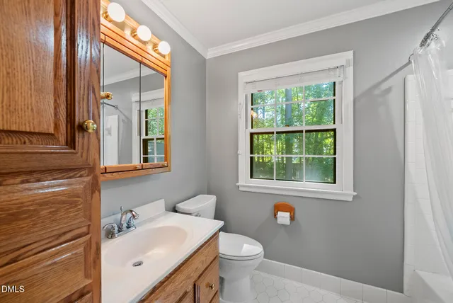 a view of a livingroom with a dishwasher and a potted plant