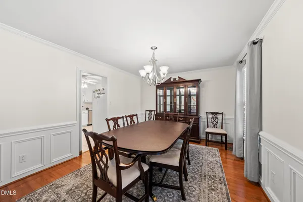 a view of a dining room with furniture and window