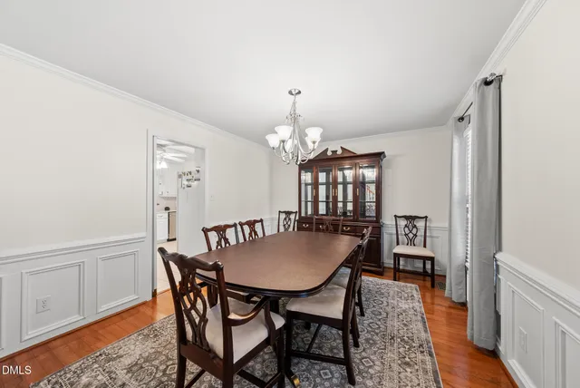 a view of a dining room with furniture and window