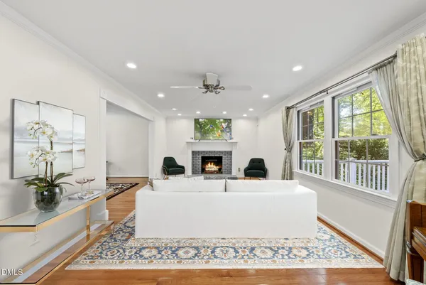 a view of a dining room with furniture and wooden floor