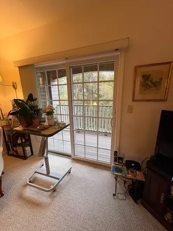 a room with gym equipment and a large window