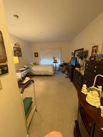 a bedroom with a bed and gym equipment