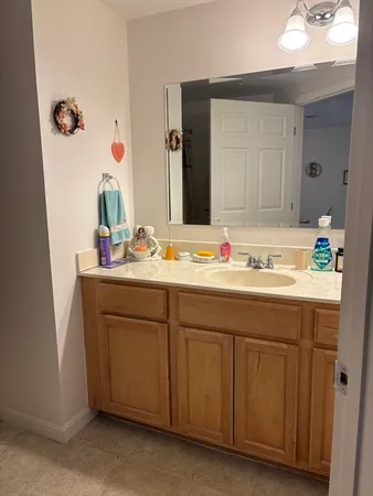 a bathroom with a sink and a mirror