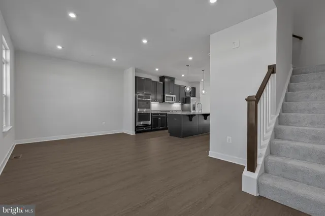 a view of kitchen and kitchen with furniture wooden floor and window