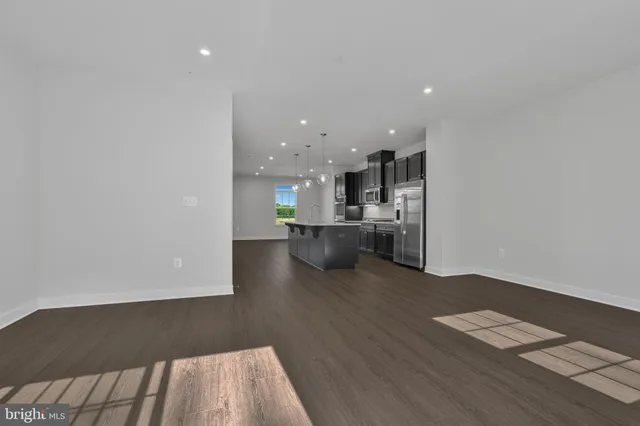 a view of kitchen with wooden floor