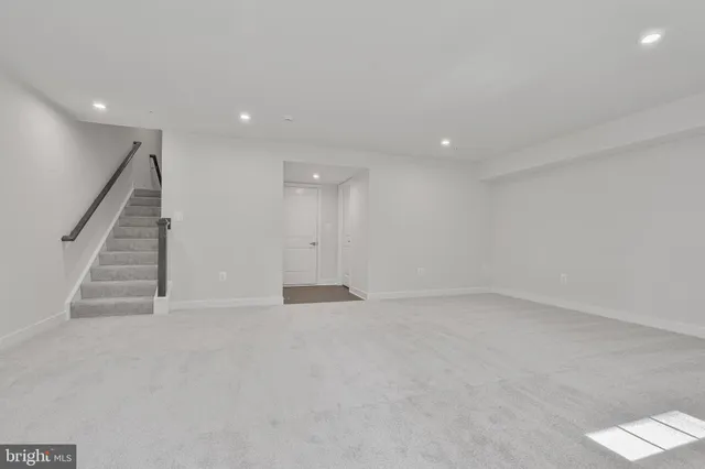 an empty room with stairs and ventilation